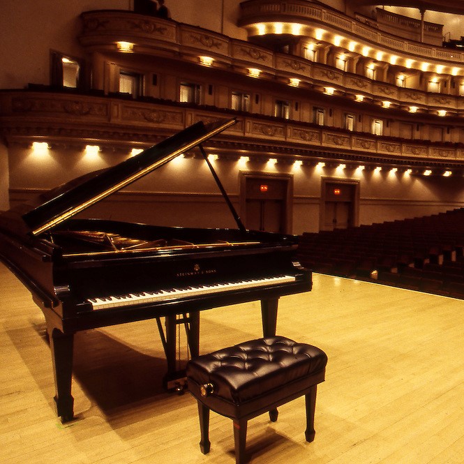 Steinway Model D Piano on the stage at Carnegie Hall, NYC, in preparation for a concert by Alfred Brendel.